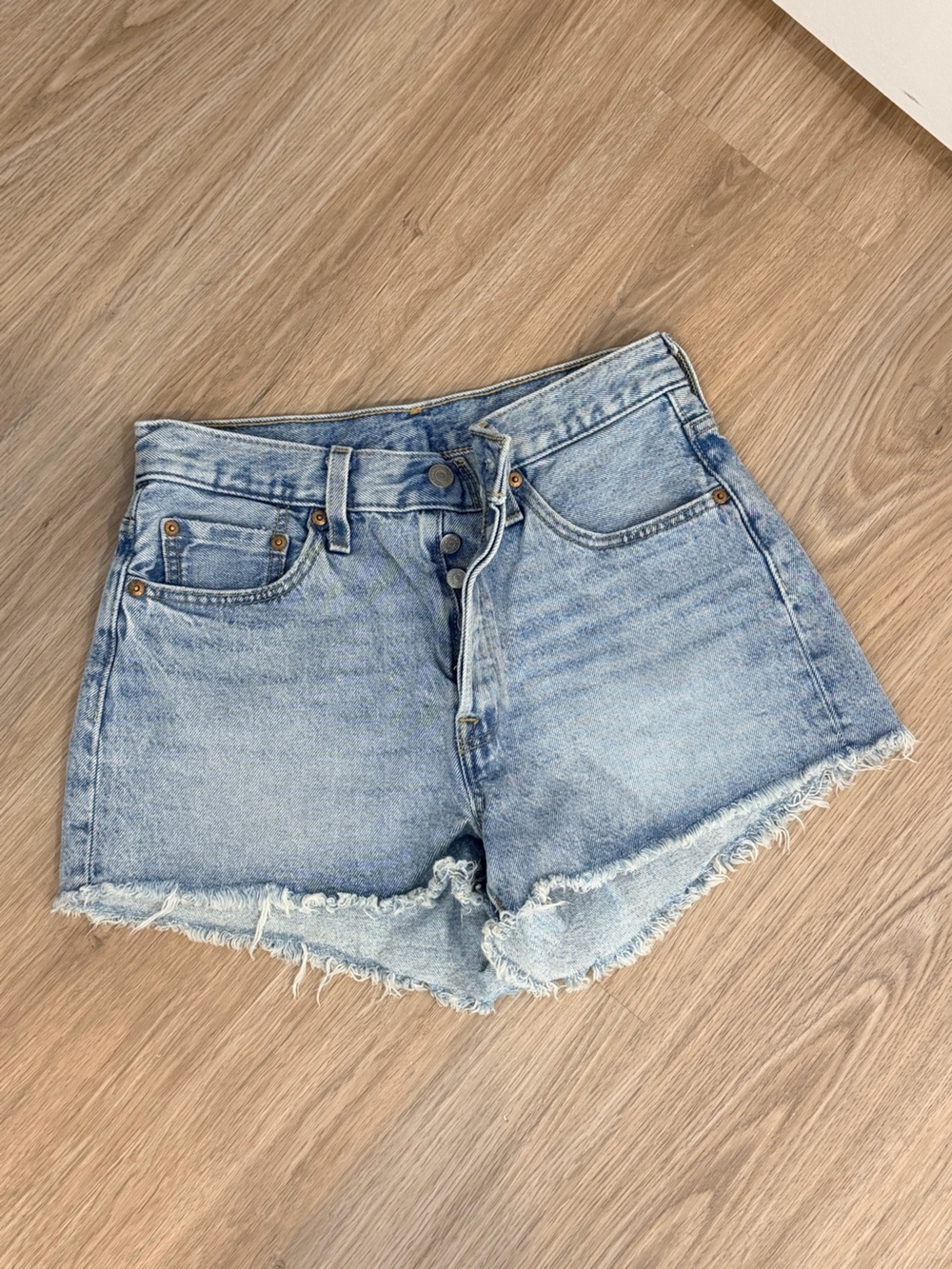 Levi's Light Wash Frayed Hem Denim Shorts
